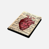 Red Anatomical Human Heart on an Antique Music Page Notebook