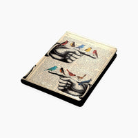 Birds resting on Hand on an Antique Book Page Notebook